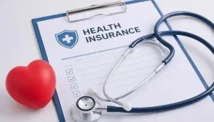 Findanyagent health insurance support clipboard form with a stethoscope and red heart.