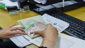 Findanyagent trusted visa agency processing a Saudi Arabia visa application and stamping an open passport.